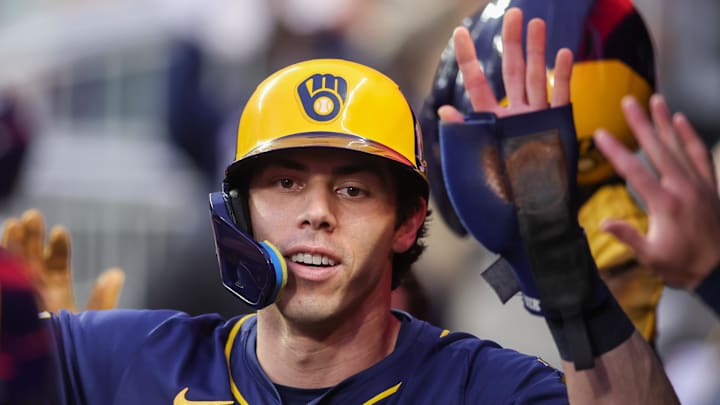 Milwaukee Brewers designated hitter Christian Yelich (22) celebrates after scoring against the Atlanta Braves at Truist Park. 