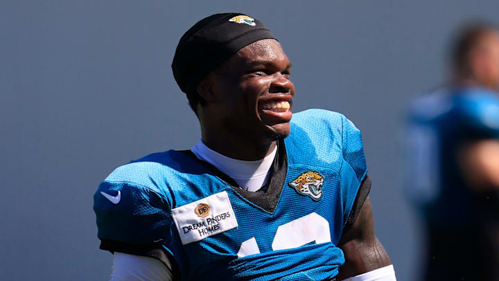 Jacksonville Jaguars wide receiver Travis Hunter (12) smiles as he walks off the field after an NFL training camp session at the Miller Electric Center, Tuesday, July 29, 2025, in Jacksonville, Fla. [Corey Perrine/Florida Times-Union]