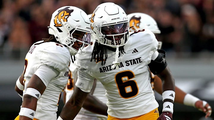 Sep 6, 2025; Starkville, Mississippi, USA; Arizona State Sun Devils defensive back Xavion Alford (2) reacts with defensive back Adrian Wilson (6) during the first quarter against the Mississippi State Bulldogs at Davis Wade Stadium at Scott Field. Mandatory Credit: Petre Thomas-Imagn Images