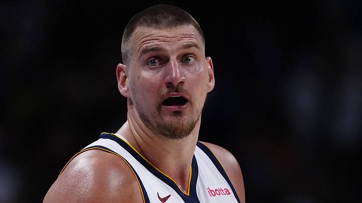 Apr 11, 2025; Denver, Colorado, USA; Denver Nuggets center Nikola Jokic (15) reacts in the fourth quarter against the Memphis Grizzlies at Ball Arena. Mandatory Credit: Ron Chenoy-Imagn Images