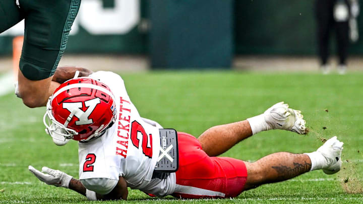 Michigan State's Jack Velling, left, catches a pass as Youngstown State's Isaiah Hackett defends during the third quarter on Saturday, Sept. 13, 2025, at Spartan Stadium in East Lansing.