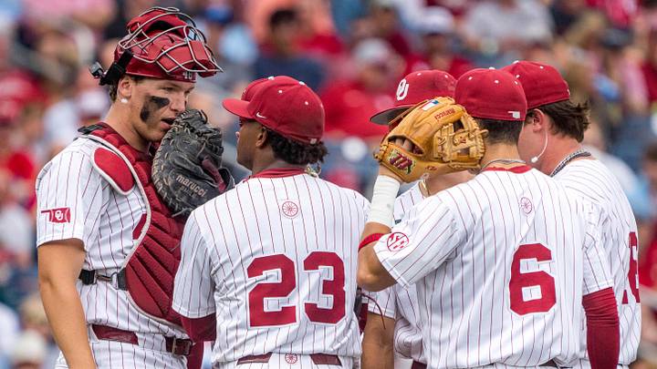 Oklahoma catcher Deiten Lachance (48) talks things over with Xander Mercurius (23) in the third inning against North Carolina Sunday. Oklahoma catcher Deiten Lachance (48) talks things over with Xander Mercurius (23) in the third inning against North Carolina Sunday.