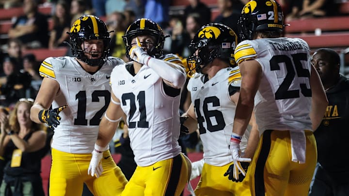 Sep 19, 2025; Piscataway, New Jersey, USA; Iowa Hawkeyes wide receiver Kaden Wetjen (21) celebrates with teammates after returning the opening kick off for a touchdown during the first quarter against the Rutgers Scarlet Knights at SHI Stadium. Mandatory Credit: Vincent Carchietta-Imagn Images