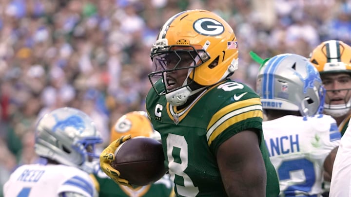 Green Bay Packers running back Josh Jacobs (8) scores a touchdown against the Detroit Lions in Week 1.