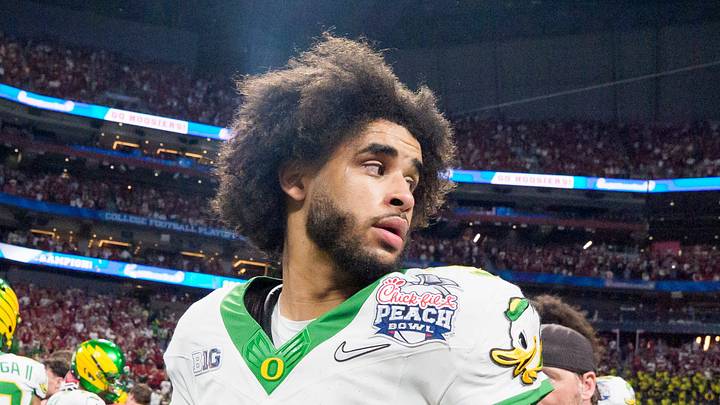 Oregon quarterback Dante Moore walks the field after the Ducks’ loss as the Oregon Ducks face the Indiana Hoosiers in the Peach Bowl on Jan. 9, 2026, at Mercedes-Benz Stadium in Atlanta, Georgia. Oregon quarterback Dante Moore walks the field after the Ducks’ loss as the Oregon Ducks face the Indiana Hoosiers in the Peach Bowl on Jan. 9, 2026, at Mercedes-Benz Stadium in Atlanta, Georgia.