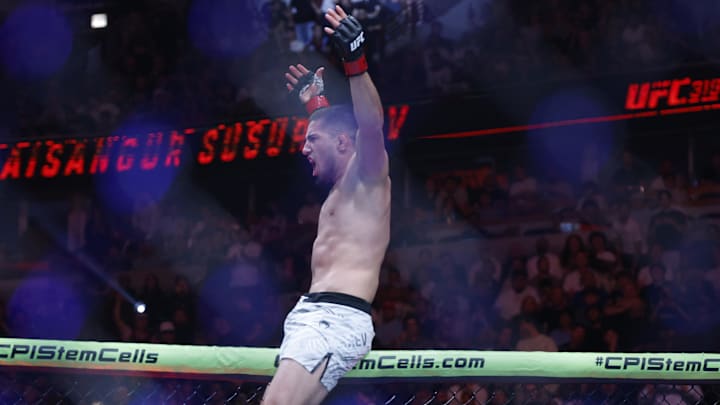Aug 16, 2025; Chicago, Illinois, UNITED STATES; Baisangur Susurkaev (red gloves) reacts after the fight against Eric Nolan (blue gloves) during UFC 319 at United Center. Mandatory Credit: Kamil Krzaczynski-Imagn Images