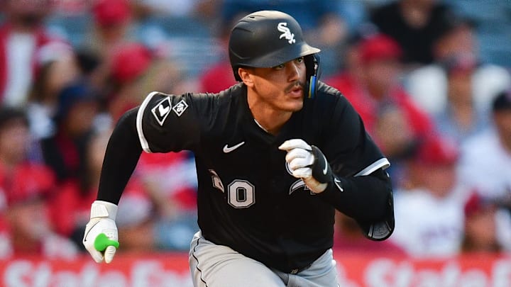 Chicago White Sox first baseman Miguel Vargas (20) hits a single against the Los Angeles Angels at Angel Stadium. 