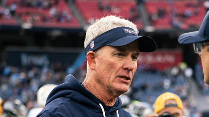 Tennessee Titans interim coach Mike McCoy greets Los Angeles Chargers coach Jim Harbaugh.