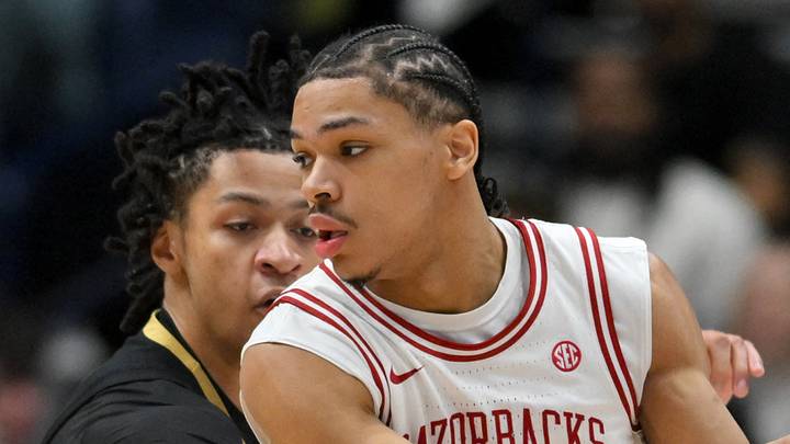 Mar 15, 2026; Nashville, TN, USA; Arkansas Razorbacks guard Darius Acuff Jr. (5) dribbles the ball defended by Vanderbilt Commodores guard Chandler Bing (7) in the second half during the men's SEC Conference Tournament Championship at Bridgestone Arena. Mandatory Credit: Steve Roberts-Imagn Images