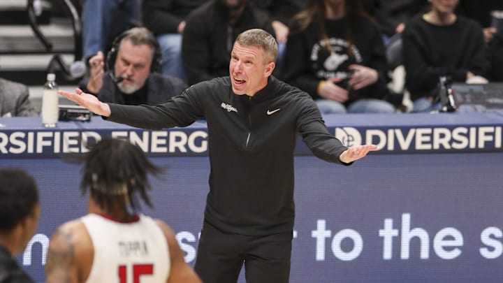 Feb 8, 2026; Morgantown, West Virginia, USA; West Virginia Mountaineers head coach Ross Hodge yells from the sideline during the first half against the Texas Tech Red Raiders at Hope Coliseum.