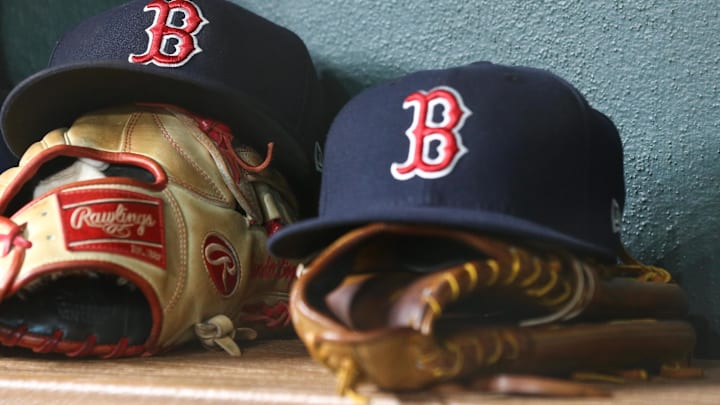 Jun 2, 2018; Houston, TX, USA; General view of Boston Red Sox caps with gloves in the dugout during the game against the Houston Astros at Minute Maid Park. Mandatory Credit: Troy Taormina-Imagn Images