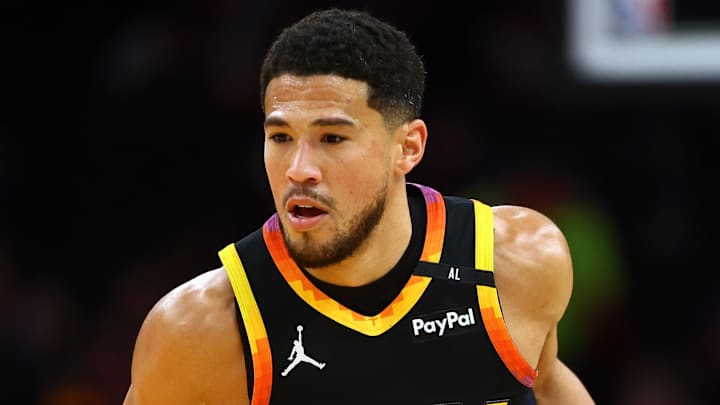 Phoenix Suns guard Devin Booker dribbles the ball against the Oklahoma City Thunder. Phoenix Suns guard Devin Booker dribbles the ball against the Oklahoma City Thunder.