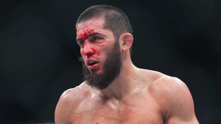 Jun 1, 2024; Newark, New Jersey, USA; Islam Makhachev (red gloves) fights Dustin Poirier (blue gloves) during UFC 302 at Prudential Center. Mandatory Credit: Joe Camporeale-Imagn Images