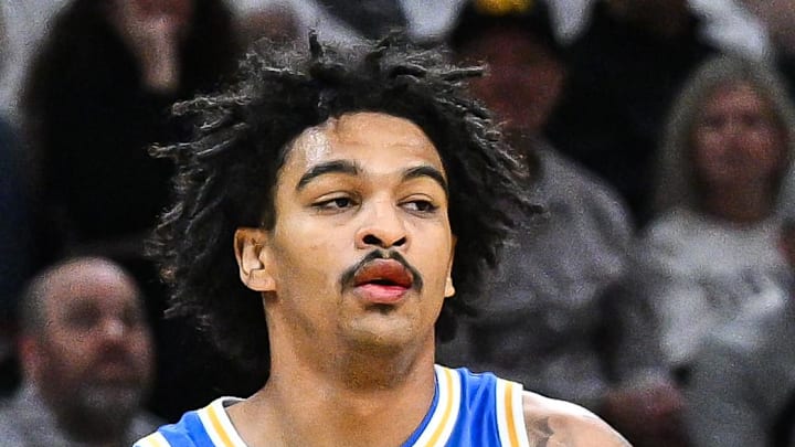 Jan 3, 2026; Iowa City, Iowa, USA; UCLA Bruins guard Skyy Clark (55) controls the ball against the Iowa Hawkeyes during the first half at Carver-Hawkeye Arena. Mandatory Credit: Jeffrey Becker-Imagn Images