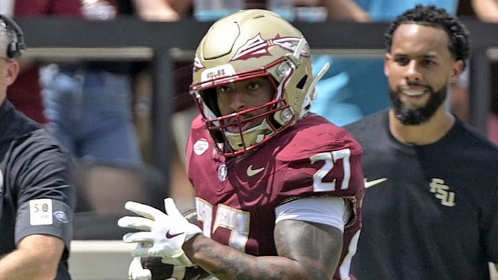 Sep 6, 2025; Tallahassee, Florida, USA; Florida State Seminoles running back Gavin Sawchuck (27) runs down the sideline for a touchdown during the second half against the East Texas A&M Lions at Doak S. Campbell Stadium. Mandatory Credit: Melina Myers-Imagn Images