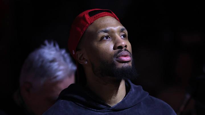 Portland Trail Blazers guard Damian Lillard (0) welcomes his teammates to the starting line up before the Trail Blazers play against the Brooklyn Nets during the first half at Moda Center on Mar 23, 2026.
