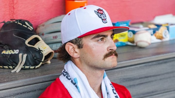 NC State baseball right-handed pitcher Cooper Consiglio rests in the dugout during 13-0 win over Sacred Heart on Sunday, March 1, 2026. 