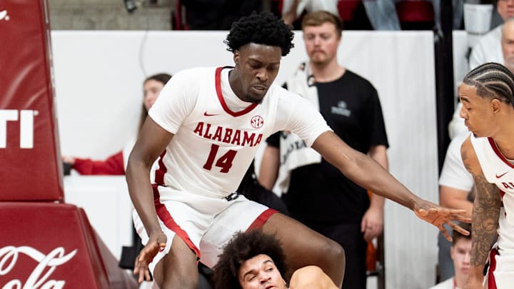 Jan 24, 2026; Tuscaloosa, AL, USA; Tennessee guard Ja'Kobi Gillespie (0) goes to the floor to save a ball in front of Alabama center Charles Bediako (14) and Alabama guard Labaron Philon Jr. (0) at Coleman Coliseum. Mandatory Credit: Gary Cosby Jr.-Tuscaloosa News