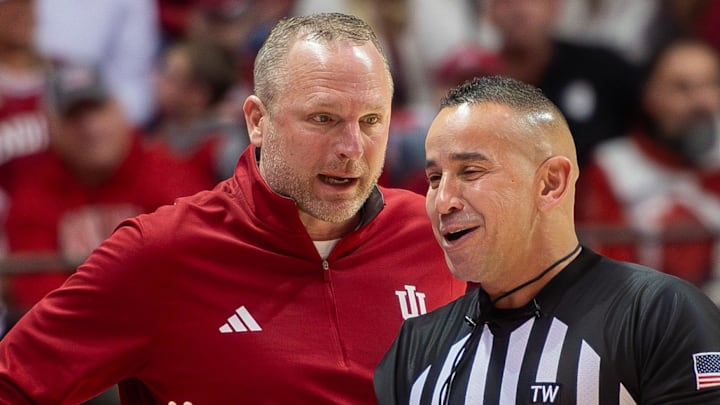 Indiana coach Darian DeVries talks with an official against Wisconsin  at Simon Skjodt Assembly Hall.