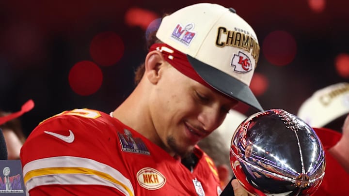 Feb 11, 2024; Paradise, Nevada, USA; Kansas City Chiefs quarterback Patrick Mahomes (15) celebrates with the Vince Lombardi Trophy after defeating the San Francisco 49ers in Super Bowl LVIII at Allegiant Stadium. Mandatory Credit: Mark J. Rebilas-Imagn Images