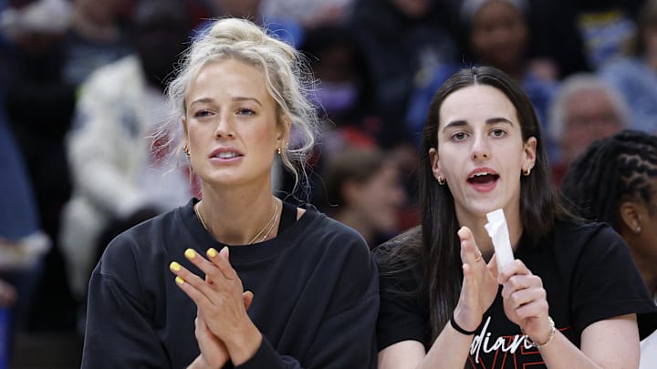 Jun 7, 2025; Chicago, Illinois, USA; Injured Indiana Fever guard Sophie Cunningham (8) and guard Caitlin Clark (22) react from the bench during the first half of a WNBA game against the Chicago Sky at United Center. Mandatory Credit: Kamil Krzaczynski-Imagn Images