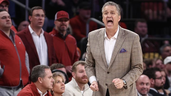 Arkansas Razorbacks coach John Calipari yells out instructions in the second half against the Michigan Wolverines at New York City's Madison Square Garden during the Hogs' nail-biting 89-87 roller-coaster victory Dec. 10. Arkansas Razorbacks coach John Calipari yells out instructions in the second half against the Michigan Wolverines at New York City's Madison Square Garden during the Hogs' nail-biting 89-87 roller-coaster victory Dec. 10.