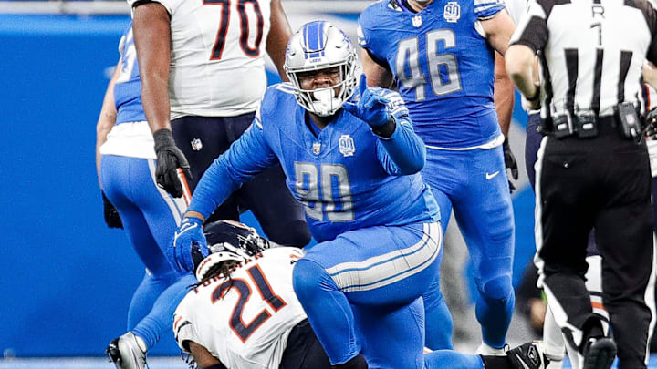 Detroit Lions defender Quinton Bohanna celebrates a tackle against Chicago Bears running back D'Onta Foreman during the first half at Ford Field in Detroit on Sunday, Nov. 19, 2023.