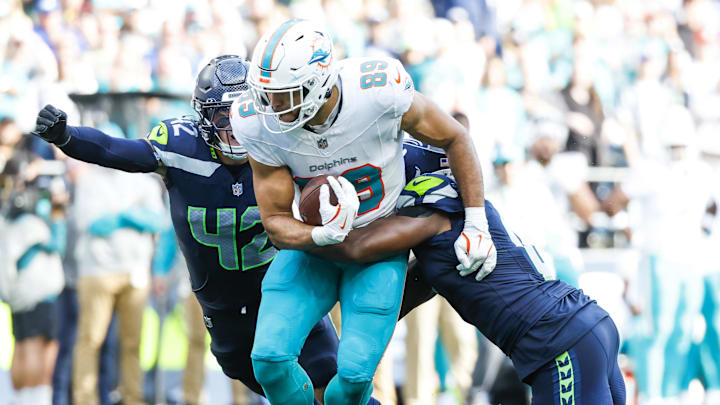 Sep 22, 2024; Seattle, Washington, USA; Seattle Seahawks linebackers Tyrel Dodson and Drake Thomas combine to make a stop against the Miami Dolphins during the fourth quarter at Lumen Field. Mandatory Credit: Joe Nicholson-Imagn Images
