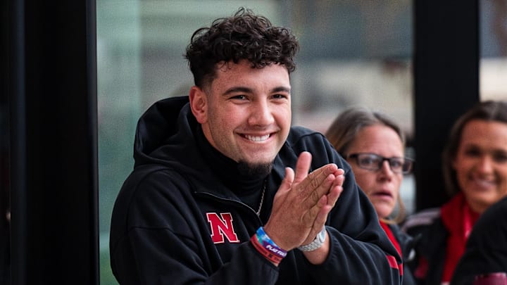 Nov 28, 2025; Lincoln, Nebraska, USA; Nebraska Cornhuskers quarterback Dylan Raiola (15) greets the team as the walk into the stadium before the game against the Iowa Hawkeyes at Memorial Stadium. Mandatory Credit: Dylan Widger-Imagn Images
