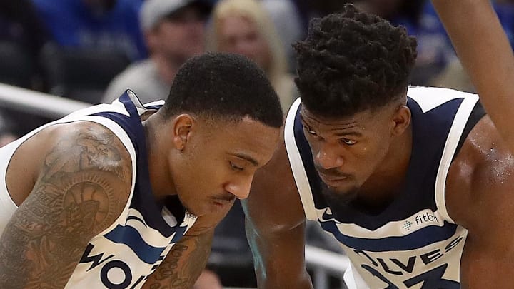 Jan 16, 2018; Orlando, FL, USA; Minnesota Timberwolves guard Jimmy Butler (23) talks with Minnesota Timberwolves guard Jeff Teague (0)  during the first half against the Orlando Magic at Amway Center. Mandatory Credit: Kim Klement-Imagn Images