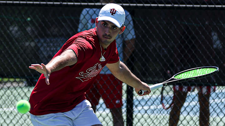 Sam Landau hits a ball April 14, 2024, during an Indiana men's tennis match vs. Wisconsin.