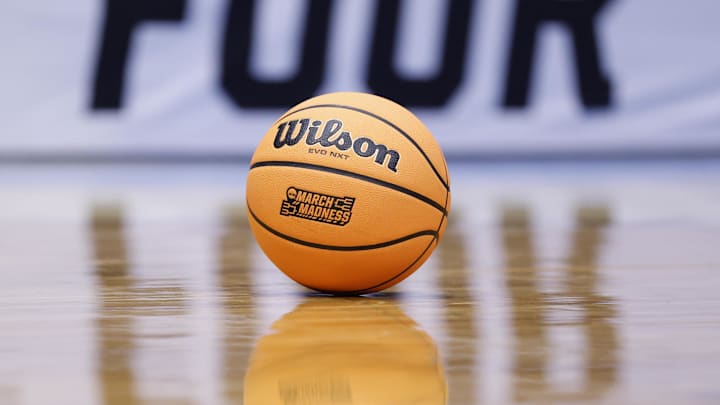 Mar 17, 2026; Dayton, OH, USA; A “March Madness” branded basketball lies on the court in the second half between the Texas Longhorns and the NC State Wolfpack during a first four game of the men's 2026 NCAA Tournament at University of Dayton Arena. Mandatory Credit: Rick Osentoski-Imagn Images