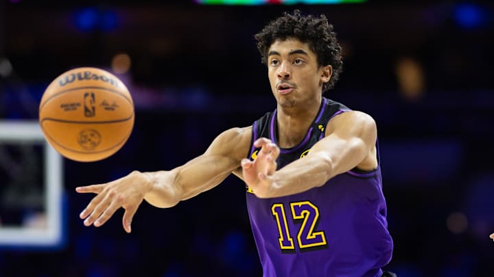 Jan 28, 2025; Philadelphia, Pennsylvania, USA; Los Angeles Lakers guard Max Christie (12) passes the ball against the Philadelphia 76ers during the second quarter at Wells Fargo Center. Mandatory Credit: Bill Streicher-Imagn Images