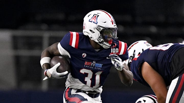 Jan 30, 2025; Arlington, TX, USA; East running back Jacory Croskey-Merritt of Arizona (31) runs with the ball against the West during the second half at AT&T Stadium. Mandatory Credit: Jerome Miron-Imagn Images