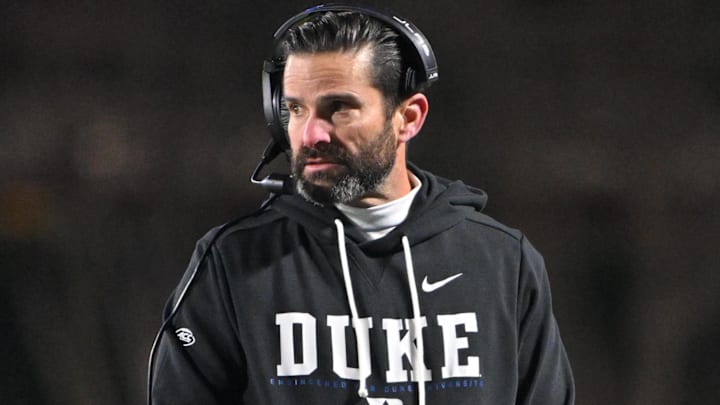 Nov 29, 2025; Durham, North Carolina, USA; Duke Blue Devils head coach Manny Diaz looks on against the Wake Forest Demon Deacons during the fourth quarter at Wallace Wade Stadium. Mandatory Credit: Zachary Taft-Imagn Images Nov 29, 2025; Durham, North Carolina, USA; Duke Blue Devils head coach Manny Diaz looks on against the Wake Forest Demon Deacons during the fourth quarter at Wallace Wade Stadium. Mandatory Credit: Zachary Taft-Imagn Images