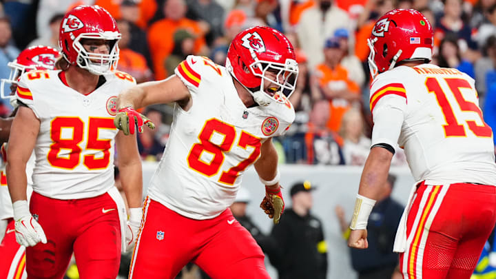 Nov 16, 2025; Denver, Colorado, USA; Kansas City Chiefs tight end Travis Kelce (87) celebrates his touchdown with quarterback Patrick Mahomes (15) and tight end Robert Tonyan (85) in the fourth quarter at Empower Field at Mile High. Mandatory Credit: Ron Chenoy-Imagn Images