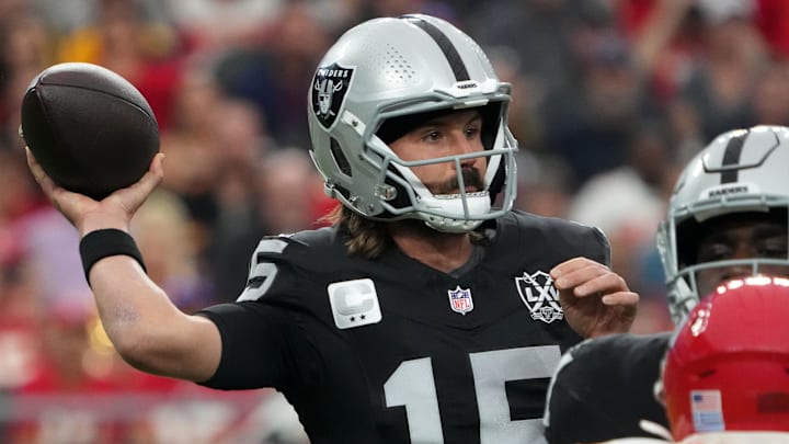 Oct 27, 2024; Paradise, Nevada, USA; Las Vegas Raiders quarterback Gardner Minshew (15) throws the ball against Kansas City Chiefs safety Chamarri Conner (27) in the first half at Allegiant Stadium. Mandatory Credit: Kirby Lee-Imagn Images
