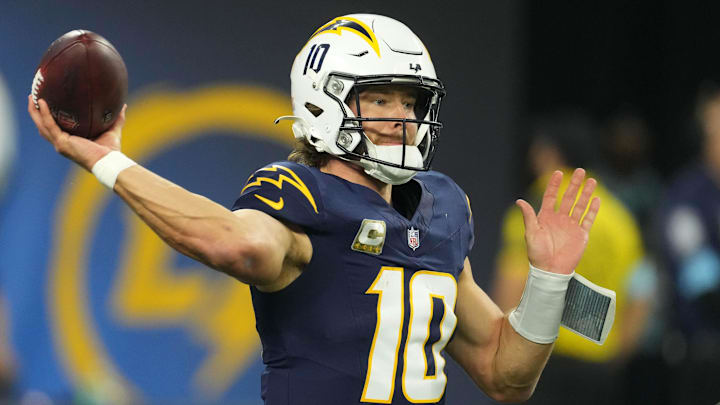 Nov 25, 2024; Inglewood, California, USA; Los Angeles Chargers quarterback Justin Herbert (10) throws the ball aBaltimore Ravens in the first half at SoFi Stadium. Mandatory Credit: Kirby Lee-Imagn Images