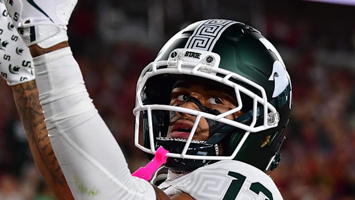Sep 20, 2025; Los Angeles, California, USA; Michigan State Spartans wide receiver Chrishon McCray (13) celebrates his touchdown scored against the Southern California Trojans during the first half at the Los Angeles Memorial Coliseum. Mandatory Credit: Gary A. Vasquez-Imagn Images