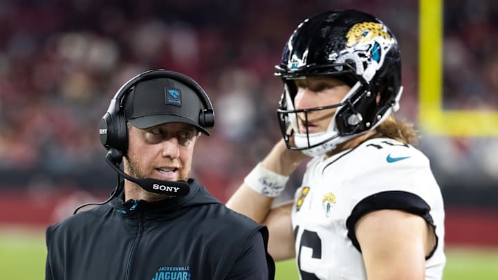 Nov 23, 2025; Glendale, Arizona, USA; Jacksonville Jaguars head coach Liam Coen with quarterback Trevor Lawrence (16) against the Arizona Cardinals at State Farm Stadium. Mandatory Credit: Mark J. Rebilas-Imagn Images