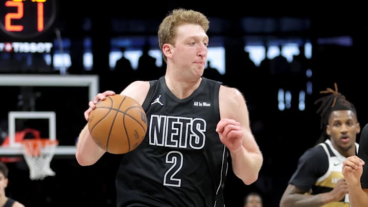 Feb 7, 2026; Brooklyn, New York, USA; Brooklyn Nets forward Danny Wolf (2) drives to the basket against Washington Wizards guard Will Riley (27) during the fourth quarter at Barclays Center. Mandatory Credit: Brad Penner-Imagn Images