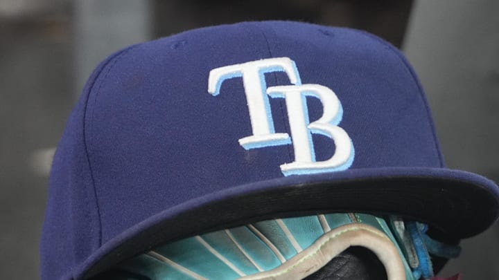 Sep 26, 2025; Toronto, Ontario, CAN; The hat and glove of Tampa Bay Rays third baseman Junior Caminero (13) in the dugout during the game against the Toronto Blue Jays at Rogers Centre. 