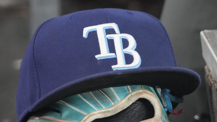 Sep 26, 2025; Toronto, Ontario, CAN; The hat and glove of Tampa Bay Rays third baseman Junior Caminero (13) in the dugout during the game against the Toronto Blue Jays at Rogers Centre. 