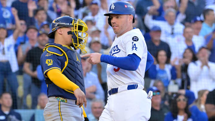Oct 16, 2025; Los Angeles, California, USA; Los Angeles Dodgers first baseman Freddie Freeman (5) scores after a throwing error by Milwaukee Brewers pitcher Abner Uribe (not pictured) in the sixth inning during game three of the NLCS round for the 2025 MLB playoffs at Dodger Stadium.