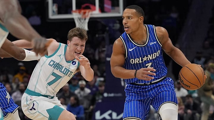 Oct 30, 2025; Charlotte, North Carolina, USA; Orlando Magic guard Desmond Bane (3) handles the ball defended baby Charlotte Hornets guard Kon Knueppel (7) and guard Sion James (4) during the first quarter at Spectrum Center. Mandatory Credit: Jim Dedmon-Imagn Imagess