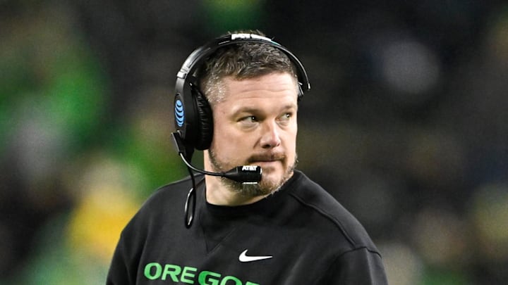 Dec 20, 2025; Eugene, OR, USA;  Oregon Ducks head coach Dan Lanning looks on during the fourth quarter against the James Madison Dukes at Autzen Stadium. Mandatory Credit: Craig Strobeck-Imagn Images