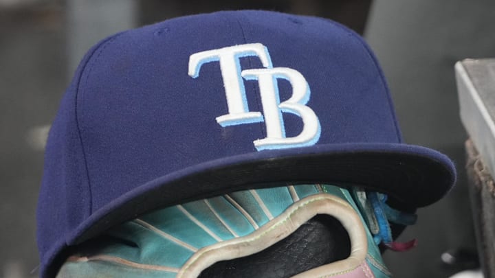 Sep 26, 2025; Toronto, Ontario, CAN; The hat and glove of Tampa Bay Rays third baseman Junior Caminero (13) in the dugout during the game against the Toronto Blue Jays at Rogers Centre. 