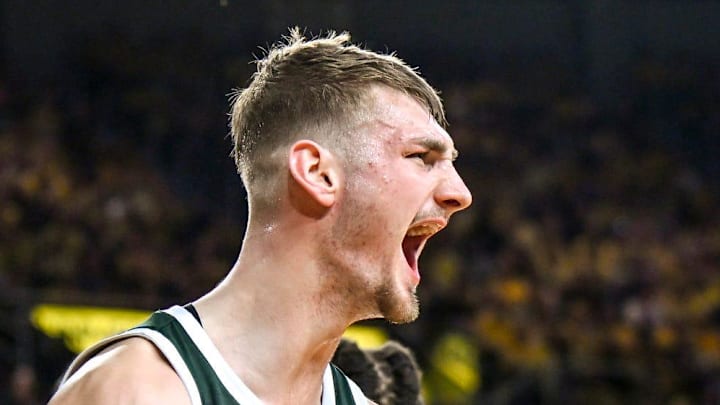 Michigan State's Carson Cooper celebrates after a scoring and drawing a Michigan foul during the second half on Sunday, March 8, 2026, at the Crisler Center in Ann Arbor. Michigan State's Carson Cooper celebrates after a scoring and drawing a Michigan foul during the second half on Sunday, March 8, 2026, at the Crisler Center in Ann Arbor.