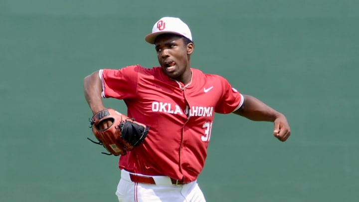 Oklahoma pitcher Cameron Johnson celebrates after getting out of an inning against Alabama.