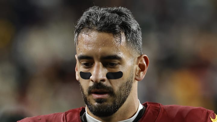 Washington Commanders quarterback Marcus Mariota walks to the medical tent against the Philadelphia Eagles